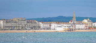 Weymouth seafront attractions and the beach from Weymouth pier. 