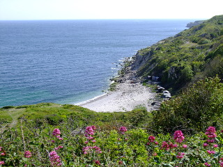 Church Ope Cove, a small idylic cove overlooked by St Andrews churchyard and Rufus Castle