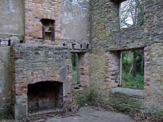 Tyneham Village photo showing the inside of one of Tyneham Villages cottages on post office row.